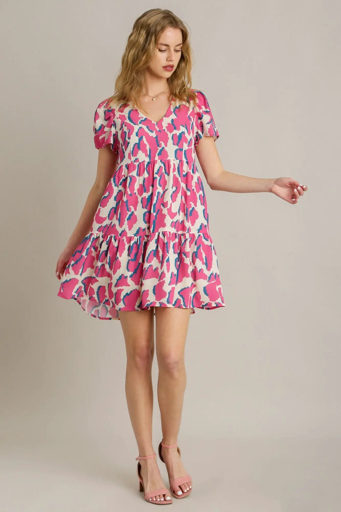Umgee Full Size Abstract Print Pleat Detail Short Sleeve V-Neck Tiered Dress Plus Size